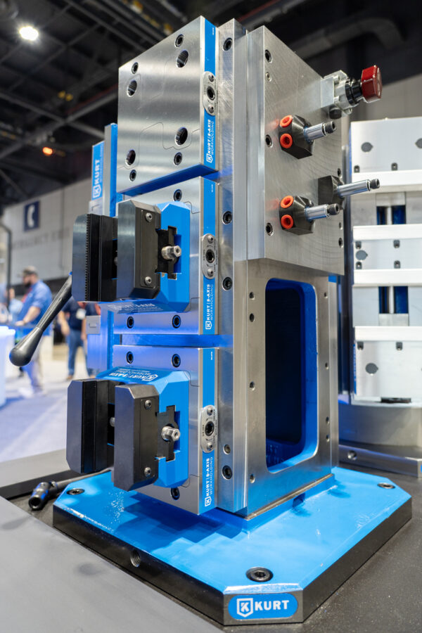 Caged tombstone with hydraulic clamps and switch