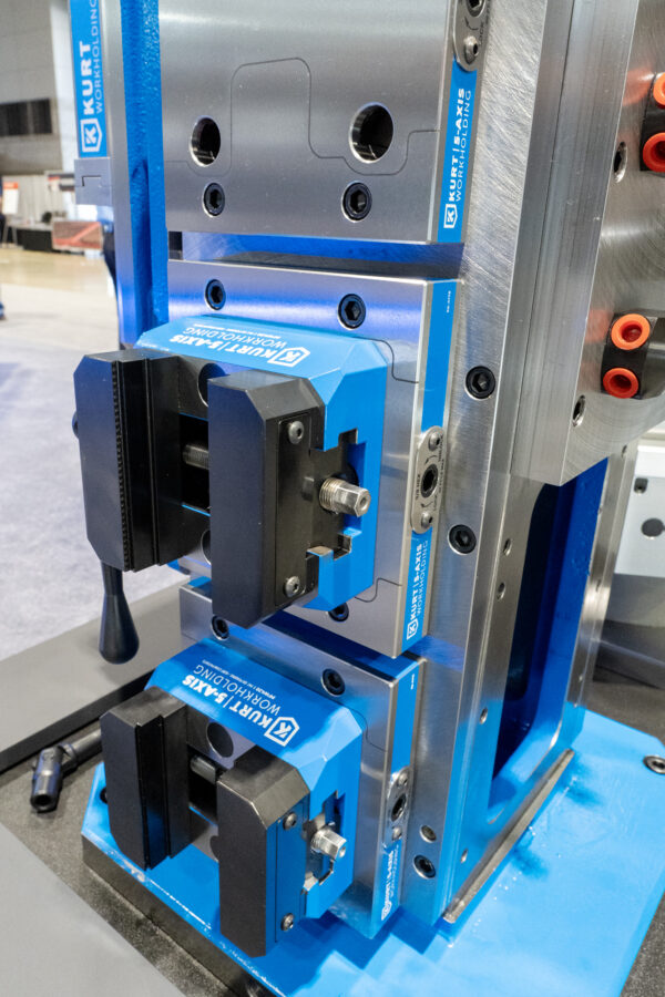 Caged tombstone with 5-axis vises